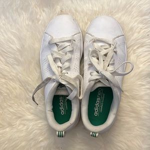 Adidas white sneakers with green stripes in back